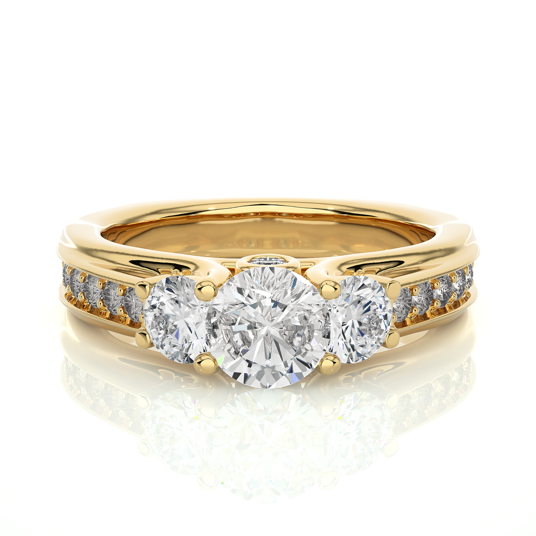 Front view of 2 Ct Round Moissanite Three Stone Engagement Ring In Yellow Gold, highlighting the brilliant center Moissanite stone.