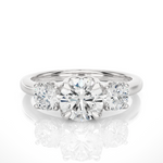 Load image into Gallery viewer, 2 Carat Round Moissanite Three Stone Engagement Ring In Rose Gold
