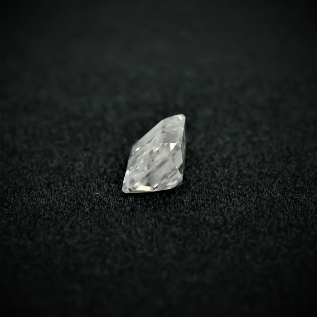 Side view of the emerald cut moissanite—sharp lines, elegant shape, and a brilliant shine from every angle.