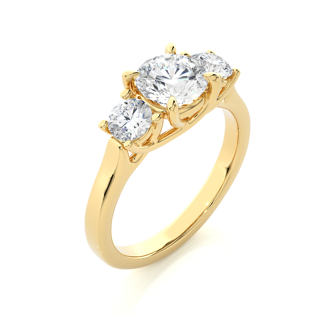 Angled view of 1.50 Ct Round Moissanite Three Stone Engagement Ring In Yellow Gold, showcasing the band and setting.​