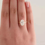 Load image into Gallery viewer, 2.30 Carat Oval Cut Moissanite Hidden Halo Engagement Ring in Yellow Gold

