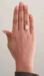 Load image into Gallery viewer, 2.30 Carat Oval Cut Moissanite Hidden Halo Engagement Ring in Yellow Gold
