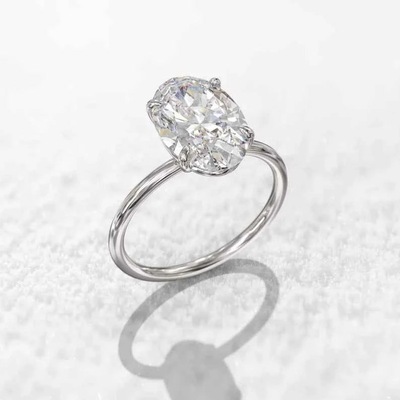 2 ct oval cut moissanite solitaire engagement ring in rose gold